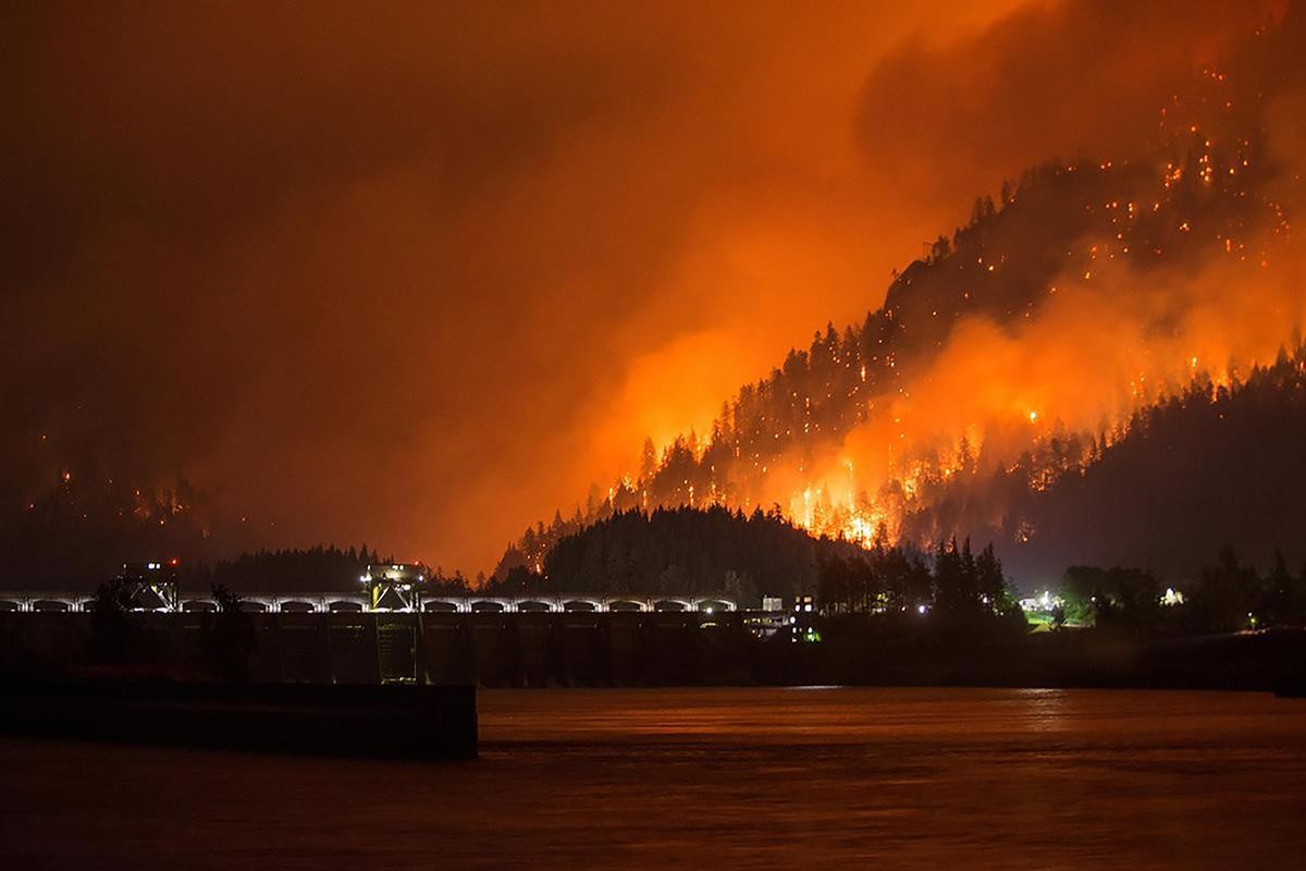 This Sept. 4, 2017, photo provided by Inciweb shows the Eagle Creek wildfire burning in the Columbia River Gorge east of Portland, Ore. A lengthy stretch of highway Interstate 84 remains closed Tuesday, Sept. 5, 2017, as crews battle the growing Eagle Creek wildfire that has also caused evacuations and sparked blazes across the Columbia River in Washington state. (Uncredited / The Associated Press)