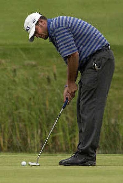 
Jason Boyd puts the finishing touch on his Lilac Invitational title with a putt on No. 18.
 (Liz Kishimoto / The Spokesman-Review)