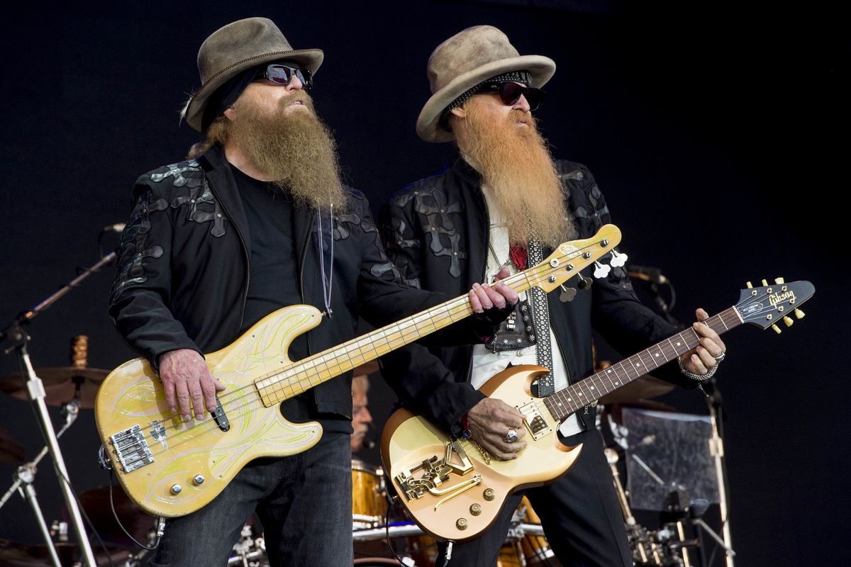 FILE - Dusty Hill, left, and Billy Gibbons from U.S rock band ZZ Top perform at the Glastonbury music festival in Somerset, England, June 24, 2016. ZZ Top has announced that Hill, one of the Texas blues trio