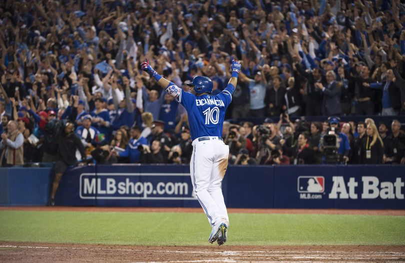 Toronto’s Edwin Encarnacion celebrates his winning walk-off three-run home run against the Baltimore Orioles during the 11th inning of the American League wild-card game in Toronto on Tuesday. (Nathan Denette / Associated Press)