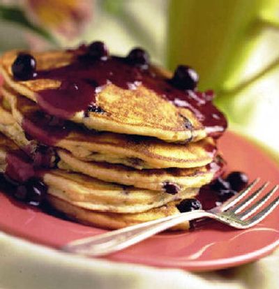 
You'll be the one who flips when you taste these pancakes. They're full of luscious blueberries, and, gilding the lily, they are served with a gingery sauce.
 (King Features Syndicate / The Spokesman-Review)