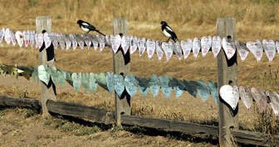 
Fans posted greetings and messages of hope to superstar Michael Jackson along a fence at his Neverland Ranch on Wednesday in Los Olivos, Calif.
 (Associated Press / The Spokesman-Review)