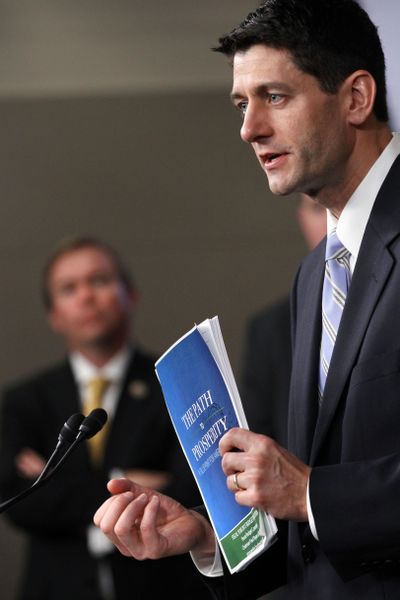 House Budget Committee Chairman Rep. Paul Ryan, R-Wis., holds a copy of his budget plan entitled “The Path to Prosperity” Tuesday in Washington. (Associated Press)