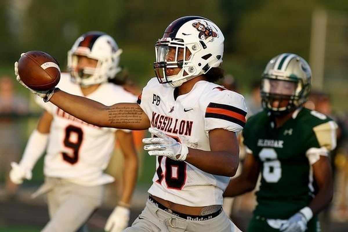 Massillon High running back Jamir Thomas holds up the ball after rushing for a touchdown last season. Thomas signed with Washington State in December. (Kevin Whitlock/)