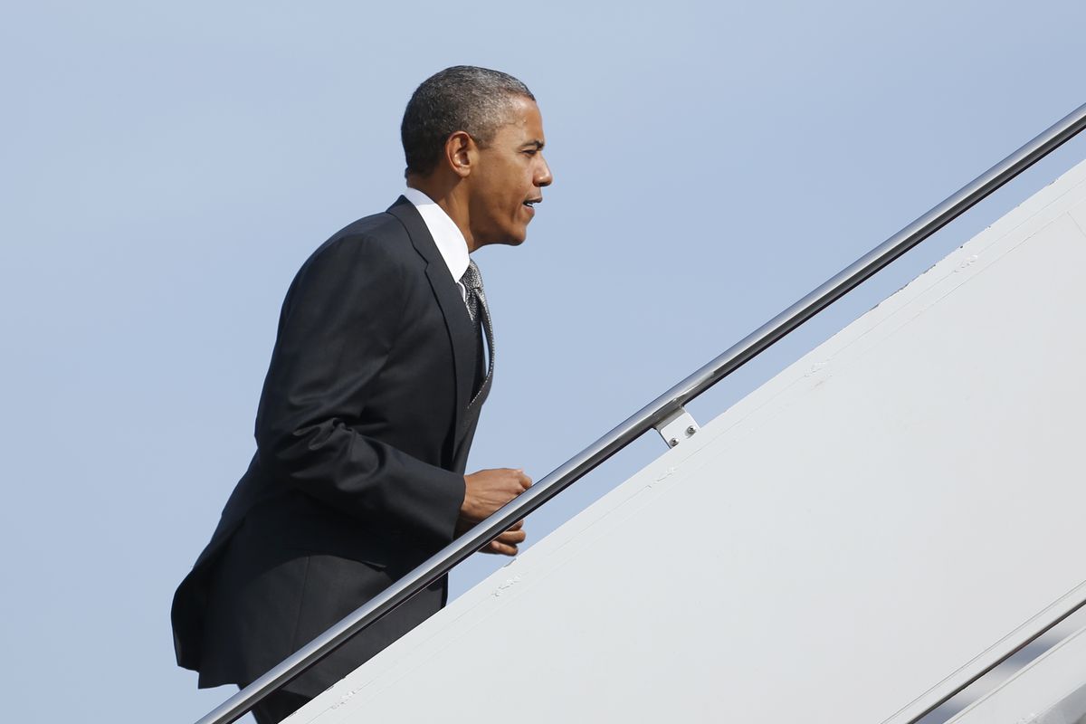 President Barack Obama boards Air Force One, Monday, Sept. 17, 2012, at Andrews Air Force Base, Md., en route to Ohio. (Carolyn Kaster / Associated Press)