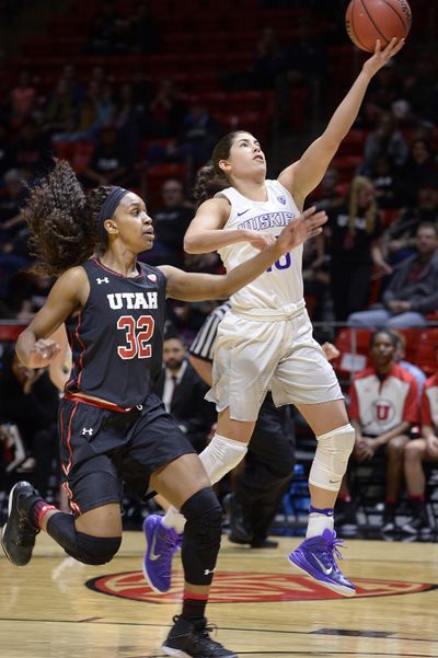 Washington guard Kelsey Plum (10) drives and scores over the defense of Utah forward Tanaeya Boclair (32) during the first half of an NCAA college basketball game Friday, Feb. 3, 2017, in Salt Lake City. (Scott Sommerdorf / Associated Press)
