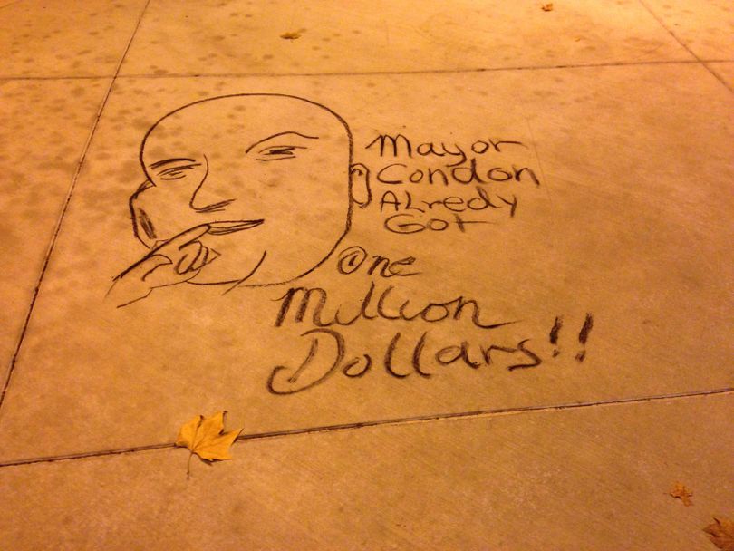 A sidewalk chalk drawing by Rick Bocook, AKA Harpman Hatter, of Dr. Evil referring to Spokane Mayor David Condon inheriting $1 million. (Nicholas Deshais)