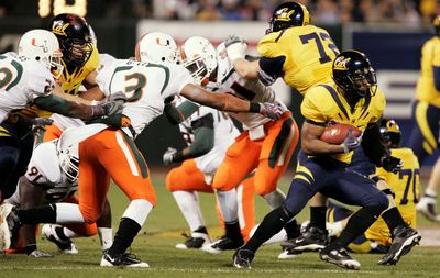 Cal’s Jahvid Best is on the run for 42 yards and a TD.  (Associated Press / The Spokesman-Review)