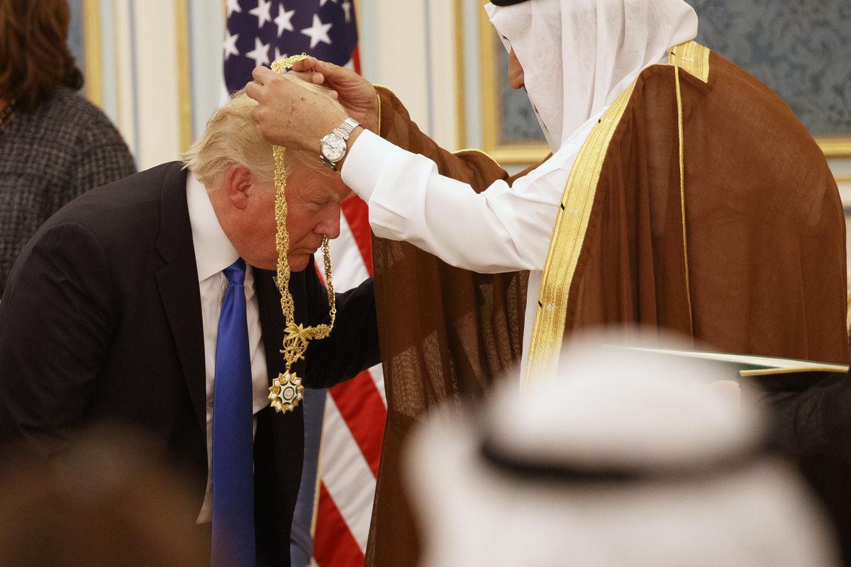 Saudi King Salman presents President Donald Trump with The Collar of Abdulaziz Al Saud Medal at the Royal Court Palace, Saturday, May 20, 2017, in Riyadh. (Evan Vucci / Associated Press)