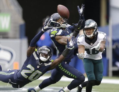 Seattle Seahawks cornerback Jeremy Lane (20) and free safety Earl Thomas, center, break up a pass intended for Philadelphia Eagles wide receiver Bryce Treggs, right, in the first half of an NFL football game, Sunday, Nov. 20, 2016, in Seattle. (Stephen Brashear / Associated Press)