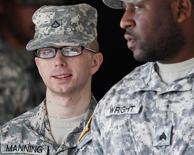 Army Pfc. Bradley Manning, left, is escorted from a courthouse in Fort Meade, Md., after closing arguments concluded in a military hearing that will determine if he should face court-martial for his alleged role in the WikiLeaks classified leaks case. (Associated Press)