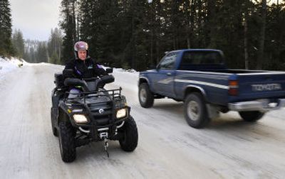 
Ken Barker, president of the Tri-County Motorized Recreation Association, rides on East Deer Lake Road in Stevens County last week. 
 (Dan Pelle / The Spokesman-Review)