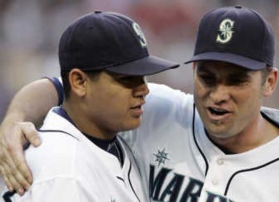 Mariners Ben Broussard, right, was on the field with starting pitcher Felix Hernandez Wednesday.Associated Press
 (Associated Press / The Spokesman-Review)