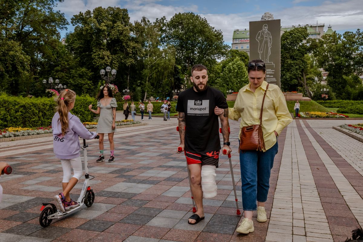 **EMBARGO: No electronic distribution, Web posting or street sales before 12:01 am. ET Sunday, July 24, 2022. No exceptions for any reasons. EMBARGO set by source.** Ruslan, an Azov battalion sergeant who lost his leg after being wounded in Mariupol, visits Shevchenko Park in Kyiv on July 17, 2022. At the Azovstal steelworks, for 80 days a relentless Russian assault met unyielding Ukrainian resistance. (Lynsey Addario/The New York Times) -- NO SALES --  (DANIEL BEREHULAK)