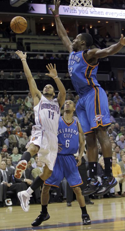 D.J. Augustin (14) and the Charlotte Bobcats knocked off Oklahoma City.  (Associated Press)