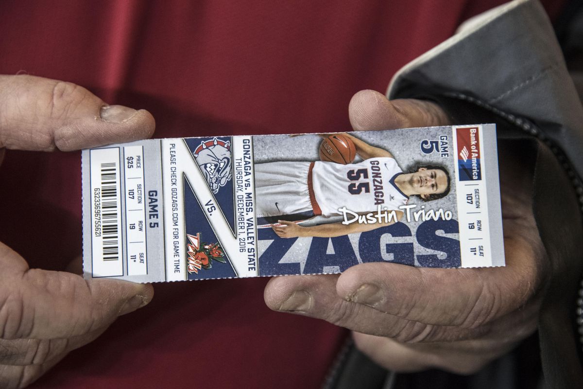 Gonzaga fan and former SID Oliver Pierce holds his ticket to the Mississippi Valley State game, Dec. 1, 2016, in the McCarthey Athletic Center. (Dan Pelle / The Spokesman-Review)