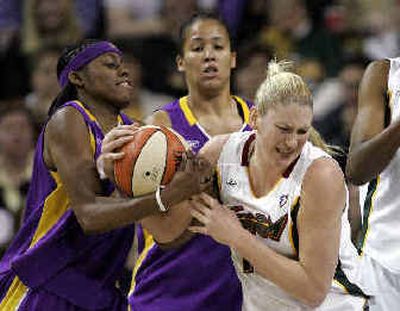 
Seattle's Lauren Jackson, right, fights for the ball against Nikki Teasley. 
 (Associated Press / The Spokesman-Review)