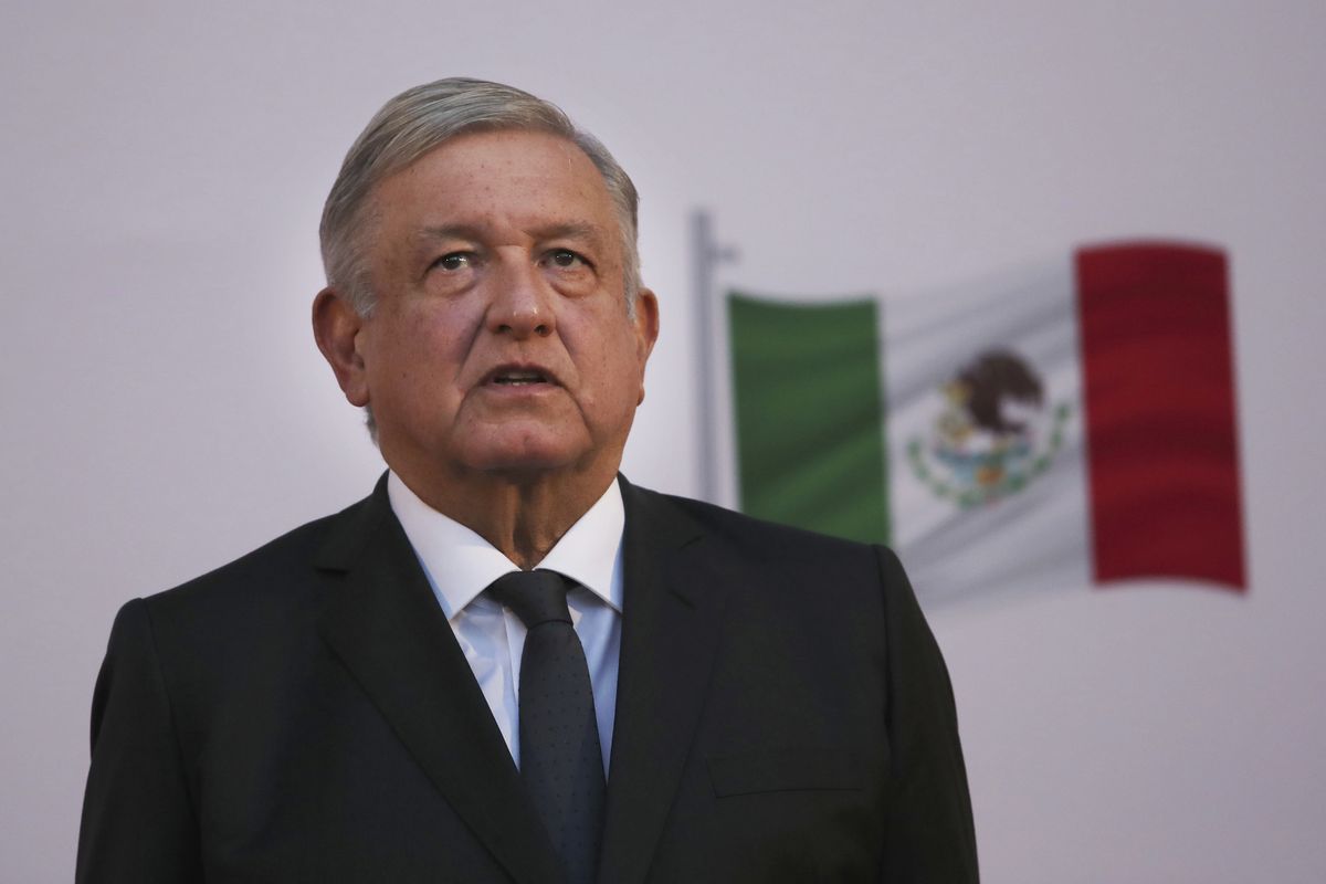Mexican President Andrés Manuel López Obrador stands during the commemoration of his second anniversary in office, at the National Palace in Mexico City, on Tuesday, December 1, 2020.  (Marco Ugarte)