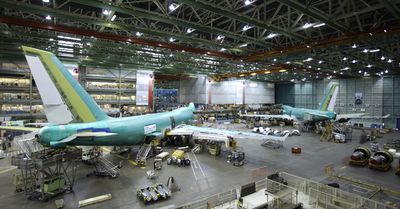 Boeing 747 airplanes are shown in January at Boeing Co.’s assembly plant in Everett. The company is forecasting lower earnings for the year as airlines delay deliveries and Boeing slows production plans. Associated Press file photos (Associated Press file photos / The Spokesman-Review)
