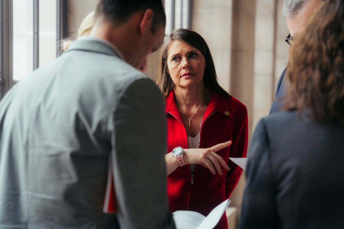 State Sen. Kathleen Kauth (R-Neb.), who sponsored a bill banning gender-affirming health treatment for minors, confers with colleagues in the Nebraska State Capitol in Lincoln, on March 21, 2023. Kauth said she became interested in transgender issues after the Biden administration demanded in May of 2022 that schools receiving free and reduced-cost meals from the federal government abide by a nondiscrimination policy that covers gender identity and sexual orientation. (Barrett Emke/The New York Times)  (BARRETT EMKE)