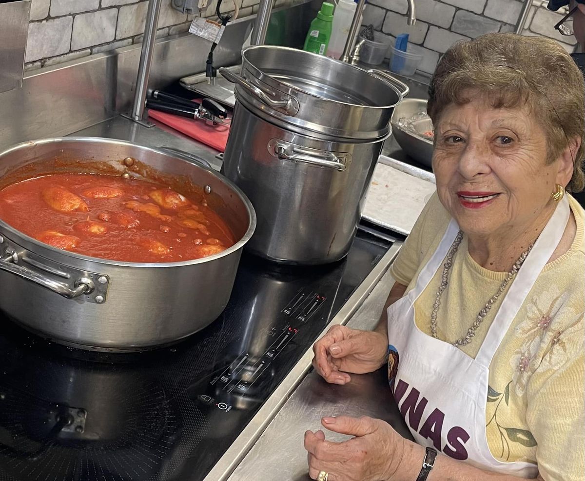 Maria Gialanella, 88, prepares a fresh Italian sauce. For the past 10 years, she has been cooking at Enoteca Maria, on Staten Island, alongside matriarchs from other cultures.    (Courtesy of Enoteca Maria/Handout)