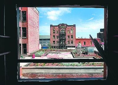 
A view from the elevator tower behind the Saranac Hotel building, left, shows the rooftop garden and future patio of the restaurant.
 (Photo by Holly Pickett / The Spokesman-Review)