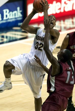 ORG XMIT: IDMOS104 Idaho guard Kashif Watson (32) shoots over New Mexico State guard Hernst Laroche (13) during the first half of an NCAA basketball game Saturday, Jan. 24, 2009 at the Cowan Spectrum in Moscow, Idaho. (AP Photo/Moscow-Pullman Daily News, Dean Hare) (Dean Hare / The Spokesman-Review)