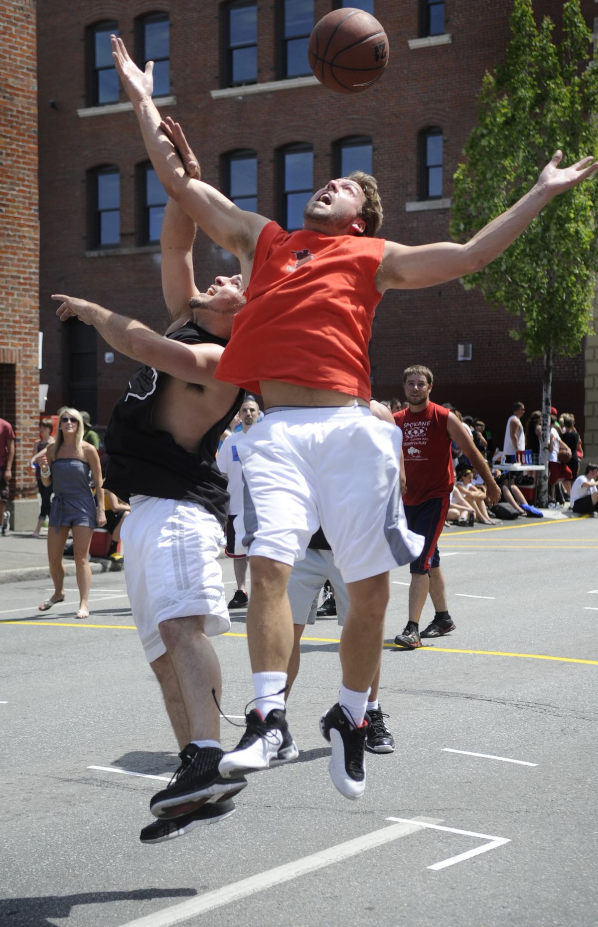 Mike Daffern of the Fish Sticks, left, and Johnny Fredrick of the Bobby Dills compete for a rebound. The Fish Sticks won 16-15 in overtime. (Colin Mulvany)