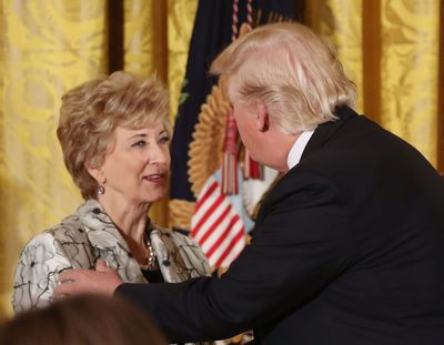 U.S. President Donald Trump greets Small Business Administration head Linda McMahon during an event celebrating Women’s History Month, in the East Room at the White House March 29, 2017, in Washington, D.C.  (Mark Wilson)