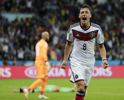 Germany’s Mesut Ozil celebrates after scoring his side’s second goal in extra time during the World Cup round of 16 on Monday. (Associated Press)