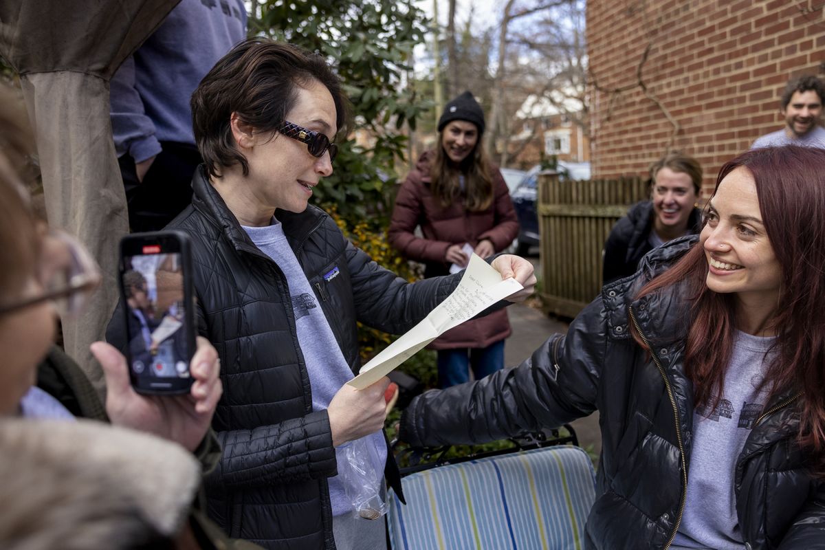 Claire Murrell reads a letter on Jan. 1 that she wrote to herself and placed in a time capsule on Dec. 31, 1999.  (Robb Hill/for The Washington Post)