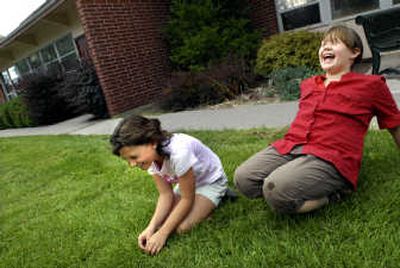 
Ashley Hoover, left, and Marissa Murinko, both 9, share a laugh as they recall schoolyard memories. The two have been friends since kindergarten. 
 (Brian Plonka / The Spokesman-Review)