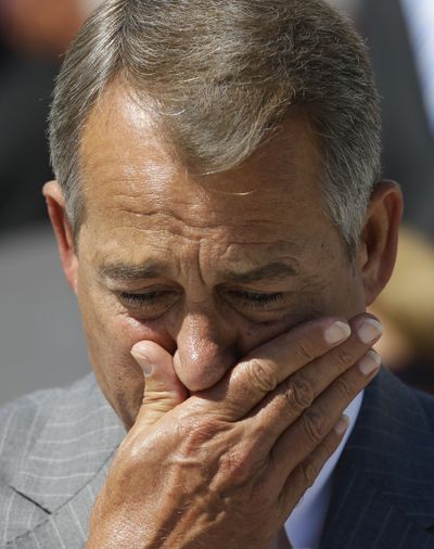 House Speaker John Boehner of Ohio becomes emotional as he speaks during a Congressional remembrance ceremony for the events of 9/11, Tuesday, Sept. 11,2012,  on the East Front of the Capitol in Washington. (Alex Brandon / Associated Press)