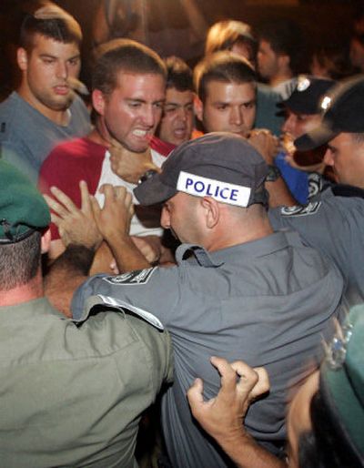 
Troops scuffle with settlers during a protest at Gush Katif  on Sunday. 
 (Associated Press / The Spokesman-Review)