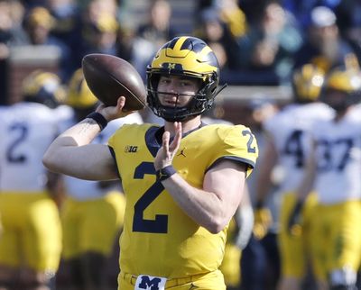 In this April 13, 2019, photo, Michigan quarterback Shea Patterson throws during the Michigan’s annual spring NCAA college football game in Ann Arbor, Mich. A string of recent high-profile transfers gave the college football world the impression it was getting easier for players to switch schools and compete right away. Patterson to Michigan, Justin Field to Ohio State and Tate Martell to Miami seemed to usher in a new era of free agency, but waiver approvals are still far from a sure thing. That is prompting athletes, coaches and others to complain about a process that can be somewhat mysterious. (Carlos Osorio / Associated Press)