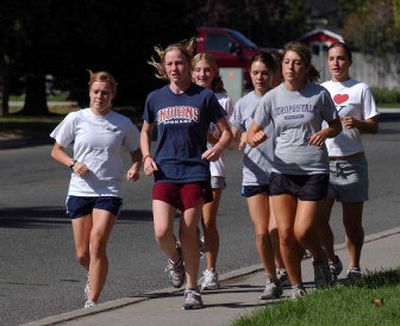 
Larson Agee, second from left, leads the West Valley girls cross country team in an afternoon run.
 (Liz Kishimoto / The Spokesman-Review)