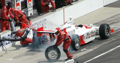 
Sam Hornish Jr. leaves his pit stall with the fuel nozzle attached.
 (Associated Press / The Spokesman-Review)