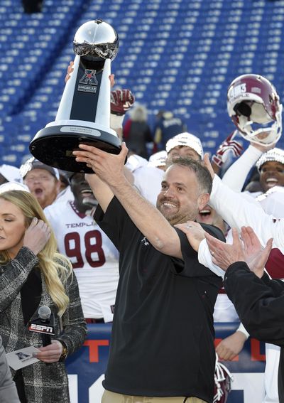 Temple head coach Matt Rhule poses with the trophy after after his Owls defeated Navy 34-10 in the American Athletic Conference championship NCAA college football game, Saturday, Dec. 3, 2016, in Annapolis, Md. (Nick Wass / Associated Press)