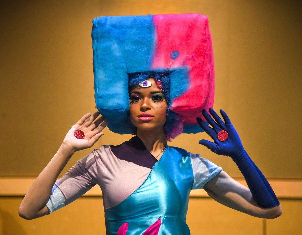 Kai Daniels, dressed as Garnet, a crystal gem, makes her way through the KuroNekoCON, Sunday, August 5, 2018, at the Spokane convention Center. (Dan Pelle / The Spokesman-Review)