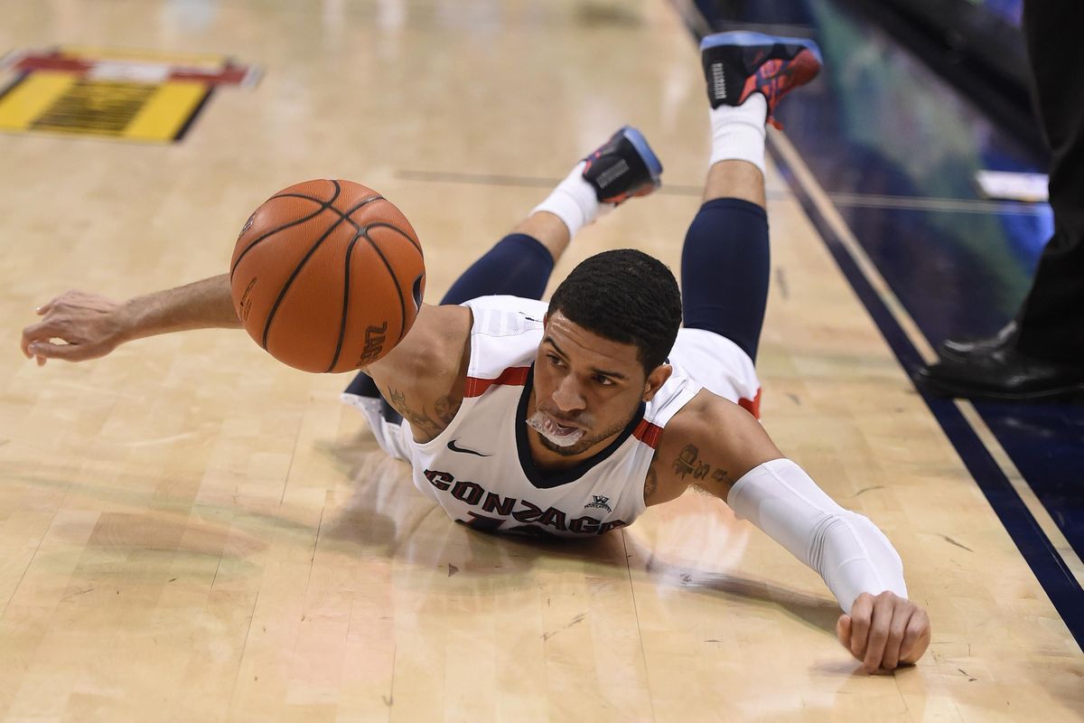 Gonzaga guard Josh Perkins (13) trips and falls on a fast break during the first half of a NCAA college basketball game against Pacific on Feb. 18, 2016 in Spokane. (Colin Mulvany / The Spokesman-Review)