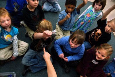 
Students in Nicole Jacobson's kindergarten class at Adams Elementary School participate in a guessing game Friday. 
 (Jed Conklin / The Spokesman-Review)
