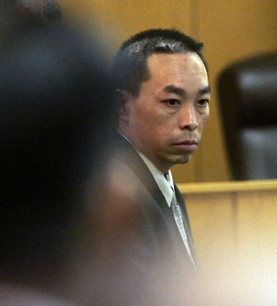 
Chai Soua Vang briefly looks back to the gallery after the guilty verdict was read in his murder trial Friday in Hayward, Wis.  
 (Associated Press / The Spokesman-Review)