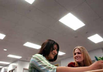 
Post Falls High School senior Jennifer Nichols, right, tutors 10th-grader Carol Faust in Spanish at the school.Post Falls High School senior Jennifer Nichols, right, tutors 10th-grader Carol Faust in Spanish at the school.
 (Kathy Plonka/Kathy Plonka/ / The Spokesman-Review)