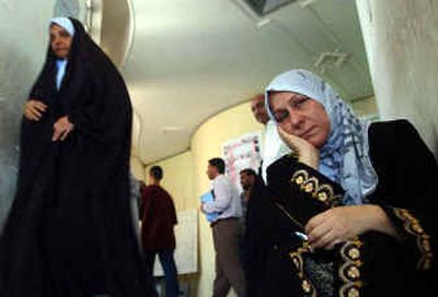 Nadia Hasan waits Monday at the Association of Free Prisoners for information on a family member who was disappeared under the rule of Saddam.
(Associated Press / The Spokesman-Review)