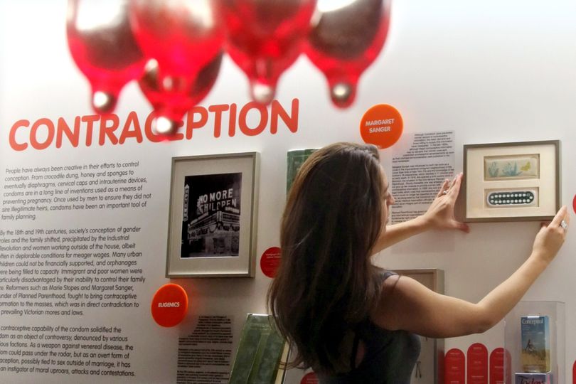 In this May 5, 2010 photo, Sarah Forbes, curator of the Museum of Sex, arranges a display packet of 