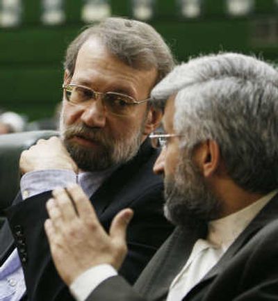 
Ali Larijani, left,  listens to Saeed Jalili during the opening ceremony of Iran's new parliament in Tehran Tuesday. Associated Press
 (Associated Press / The Spokesman-Review)