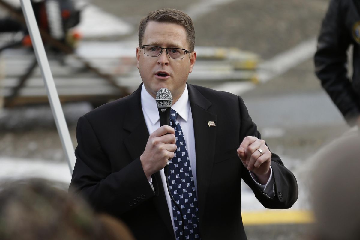 Washington state Rep. Matt Shea speaks at a gun rally in Olympia in January 2017. The Spokane Valley Republican is facing intense criticism for distributing a document titled “Biblical Basis for War, with some major campaign donors requesting refunds. (Ted S. Warren / AP)