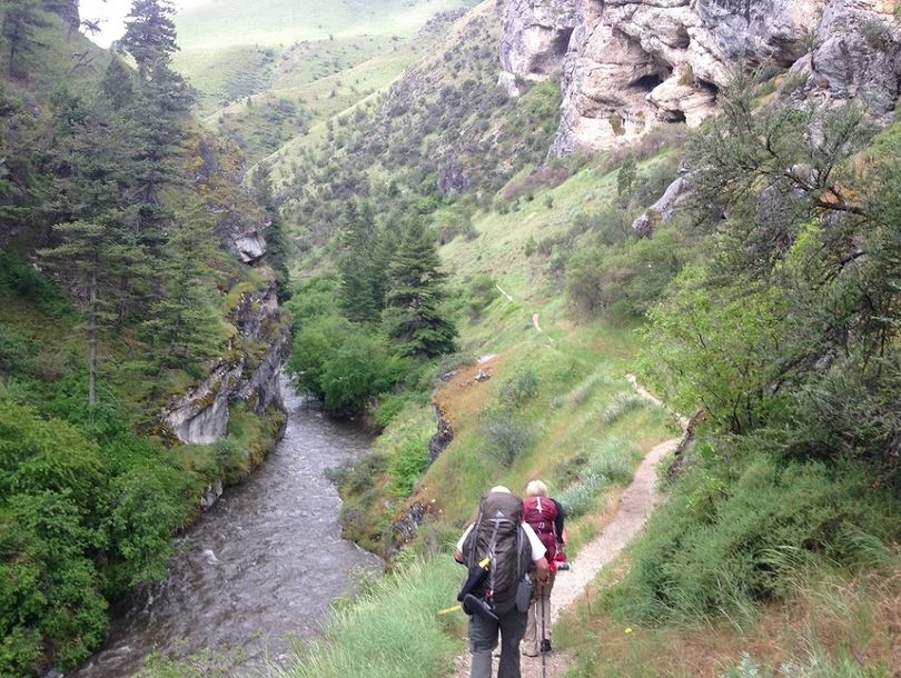 Two backpackers admire the view during a hike along the Rapid River, southwest of Riggins, Idaho. (Jim Allen)