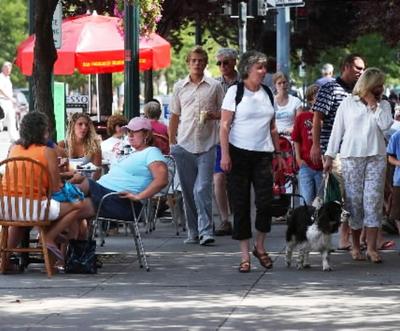 The sidewalk along Sherman Avenue in Coeur d'Alene is packed with people, in this SR file photo.
