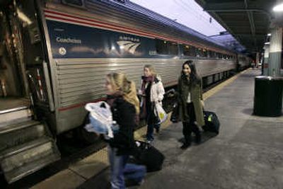 
Passengers board an Amtrak train at Union Station in Washington.  Last year Amtrak carried 25.8 million passengers, the most since it started operations in 1971.Associated Press
 (Associated Press / The Spokesman-Review)